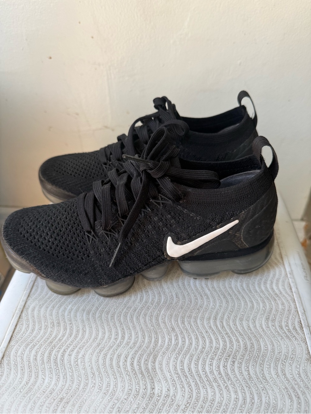 Nike Black Flyknit Sneakers with White Swoosh